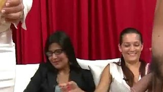 Women watch men using hand job toy