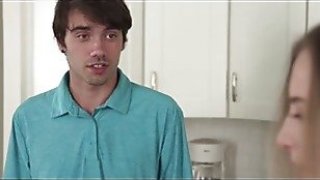 My stepbrother helps me put a big load in the laundrysahd